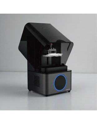 AccuFab-L4D dental 3D printer with the lid open, showing a dental model being printed on the build platform.